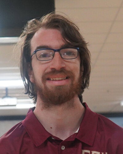 Photo of Bryan Blatt - Male smiling wearing a garnet FSU polo shirt with FSU logo