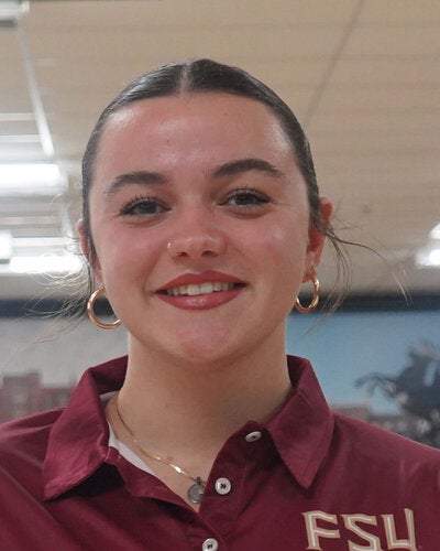 Photo of Koral Grimsley - Female smiling wearing a garnet FSU polo shirt with FSU logo