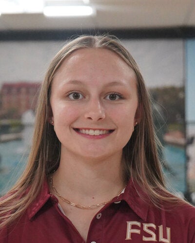 Photo of Chealsea McDaniel - Female smiling wearing a garnet FSU polo shirt with FSU logo