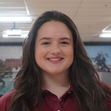 Photo of Cameron Ford - Female smiling wearing a garnet FSU polo shirt with FSU logo