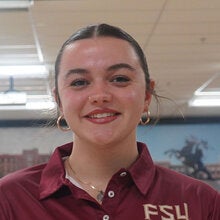 Photo of Koral Grimsley - Female smiling wearing a garnet FSU polo shirt with FSU logo