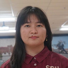 Photo of Han Ly - Female smiling wearing a garnet FSU polo shirt with FSU logo