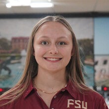 Photo of Chealsea McDaniel - Female smiling wearing a garnet FSU polo shirt with FSU logo